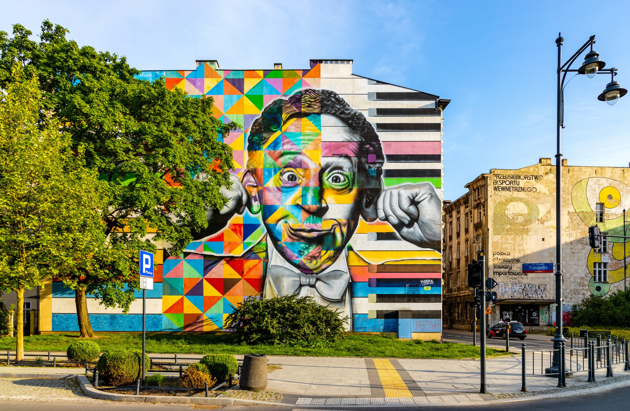 Traugutta street panorama with famous Arthur Rubinstein mural in historic city center of Lodz old town in Poland